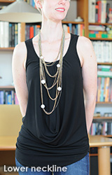 Lower neckline and contrasting necklace