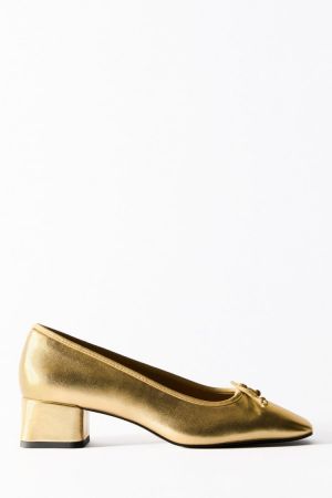 Are metallic gold leather boots really a things this season?